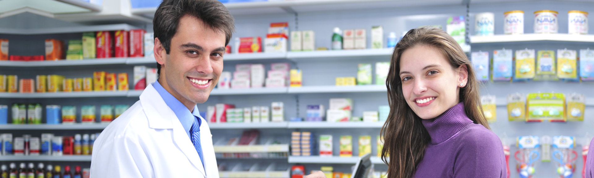 male pharmacist and a female costumer smiling