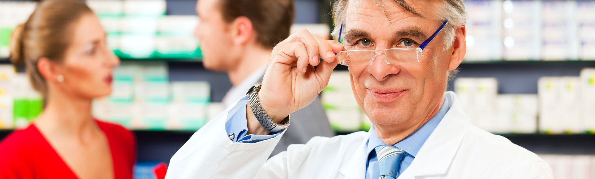 male doctor ajusting his glasses