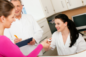 Customer giving a piece of paper to a pharmacist