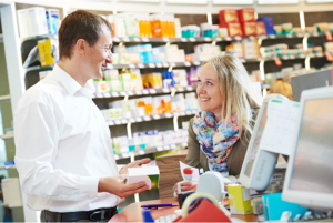 Pharmacist talking to a customer